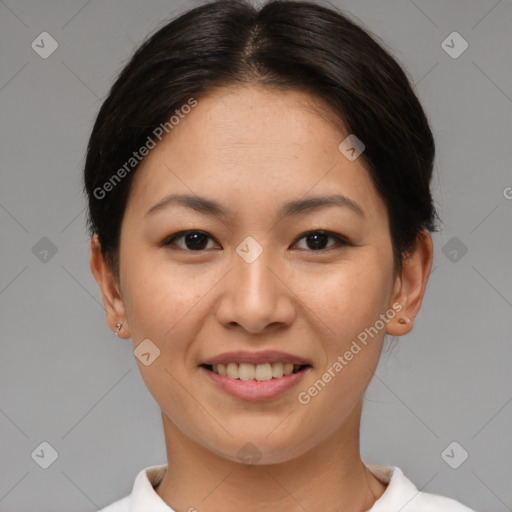 Joyful asian young-adult female with short  brown hair and brown eyes