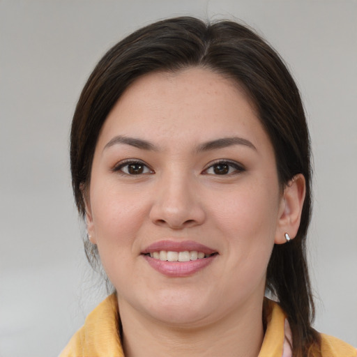 Joyful white young-adult female with medium  brown hair and brown eyes