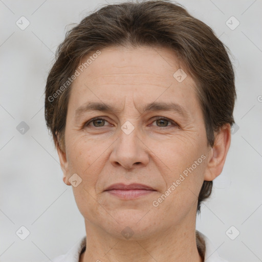 Joyful white adult female with short  brown hair and brown eyes