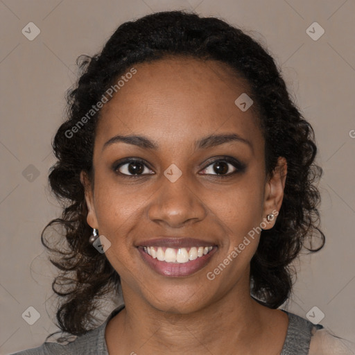 Joyful black young-adult female with medium  black hair and brown eyes