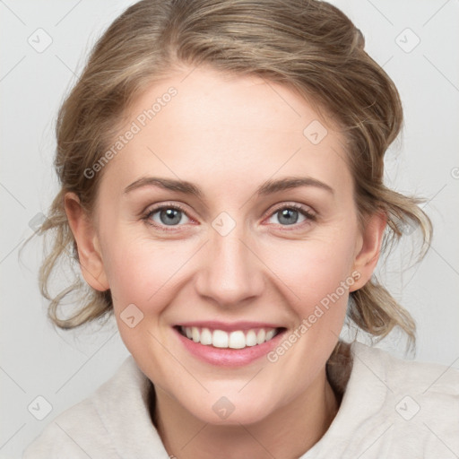 Joyful white young-adult female with medium  brown hair and blue eyes