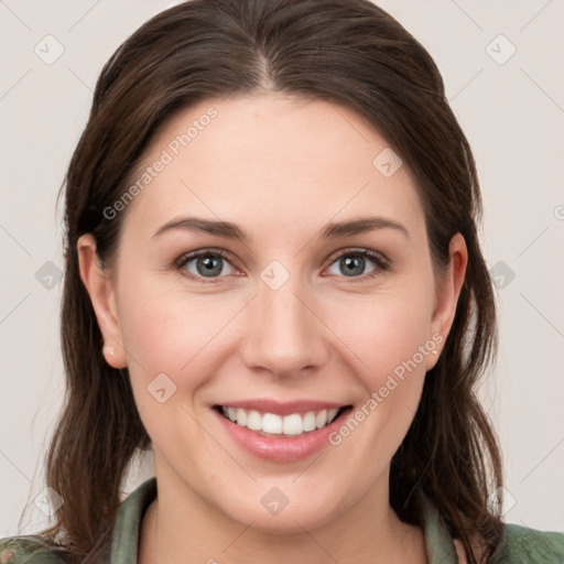 Joyful white young-adult female with medium  brown hair and green eyes