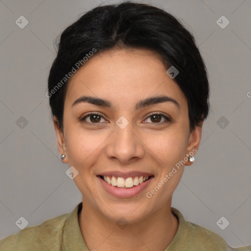 Joyful latino young-adult female with short  brown hair and brown eyes