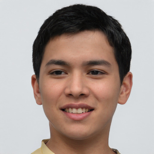 Joyful asian young-adult male with short  brown hair and brown eyes