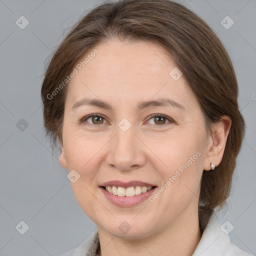 Joyful white adult female with medium  brown hair and brown eyes