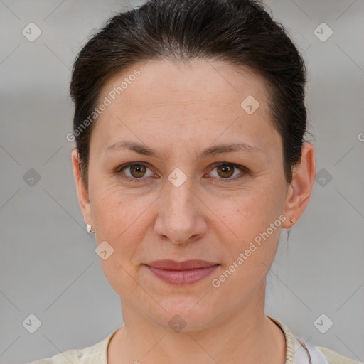 Joyful white adult female with short  brown hair and brown eyes