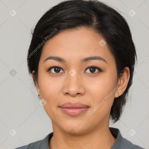 Joyful latino young-adult female with medium  black hair and brown eyes