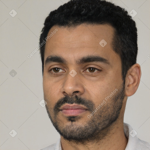 Neutral latino young-adult male with short  black hair and brown eyes
