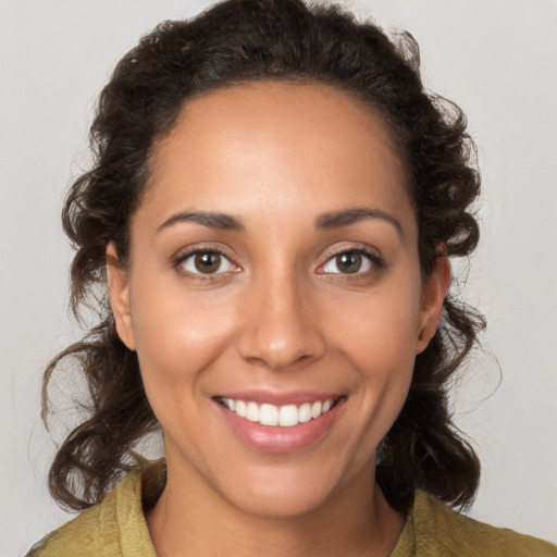 Joyful white young-adult female with medium  brown hair and brown eyes