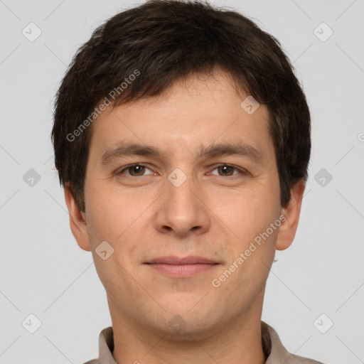 Joyful white young-adult male with short  brown hair and brown eyes