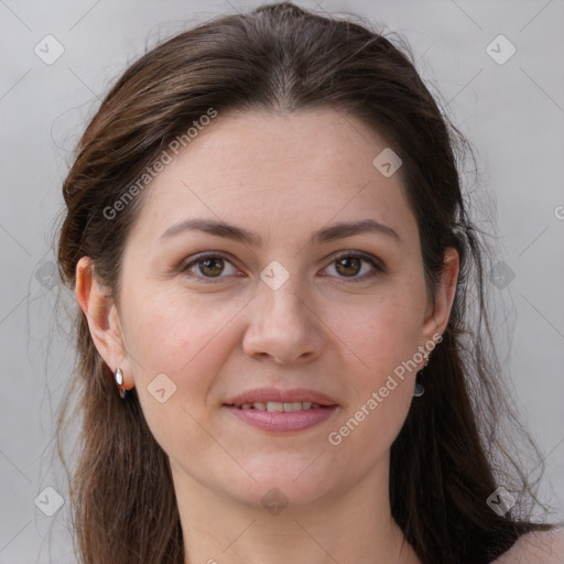 Joyful white young-adult female with long  brown hair and grey eyes