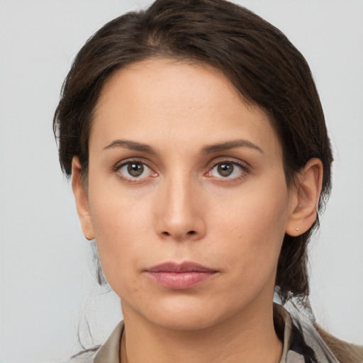 Neutral white young-adult female with medium  brown hair and brown eyes