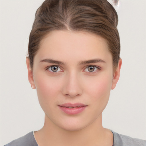 Neutral white young-adult female with short  brown hair and brown eyes