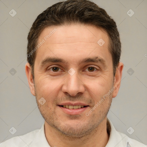 Joyful white adult male with short  brown hair and brown eyes