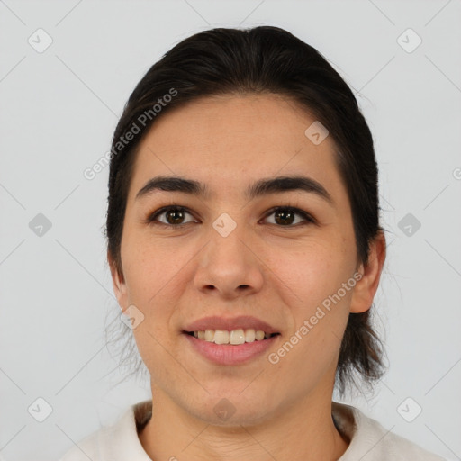 Joyful asian young-adult female with medium  brown hair and brown eyes