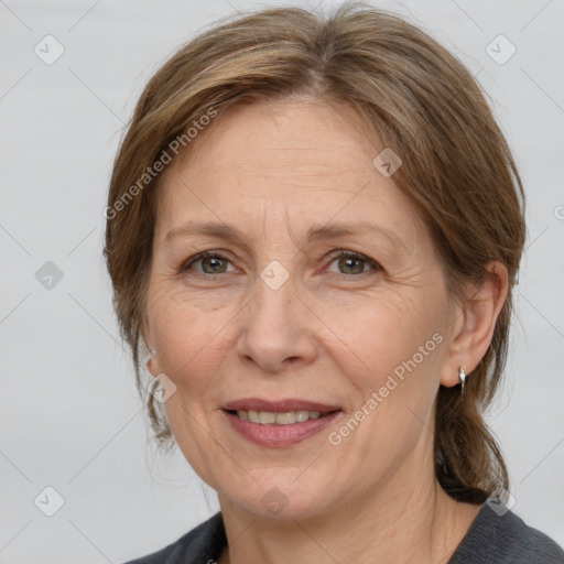 Joyful white adult female with medium  brown hair and grey eyes