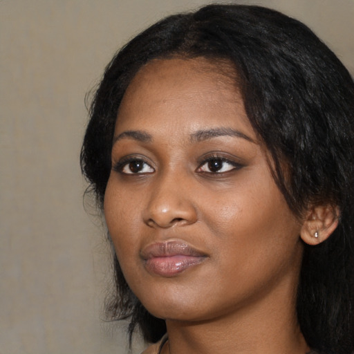 Neutral black young-adult female with medium  black hair and brown eyes