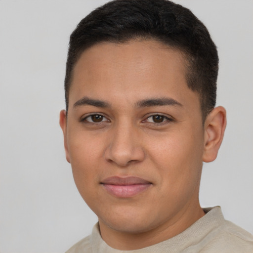 Joyful latino young-adult male with short  brown hair and brown eyes