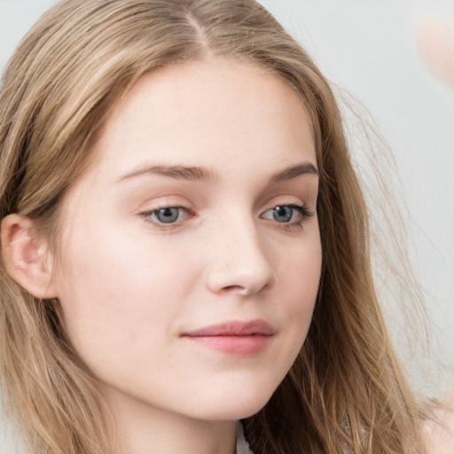 Neutral white young-adult female with long  brown hair and grey eyes