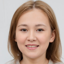 Joyful white child female with medium  brown hair and brown eyes