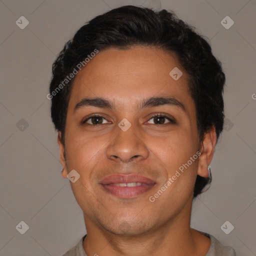 Joyful latino young-adult male with short  brown hair and brown eyes