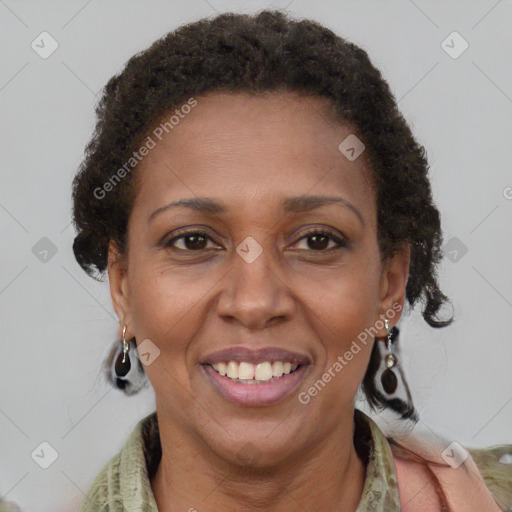 Joyful black adult female with short  brown hair and brown eyes