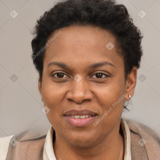 Joyful black adult female with short  brown hair and brown eyes