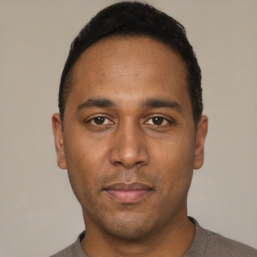 Neutral black adult male with short  black hair and brown eyes