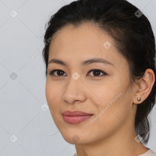 Joyful asian young-adult female with medium  brown hair and brown eyes