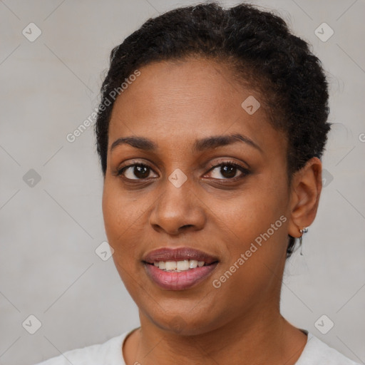 Joyful black young-adult female with short  brown hair and brown eyes