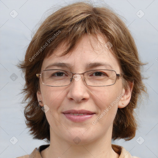 Joyful white adult female with medium  brown hair and blue eyes