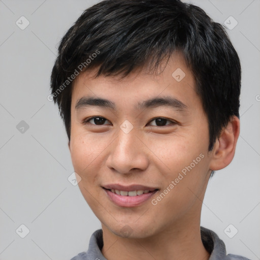 Joyful asian young-adult male with short  black hair and brown eyes