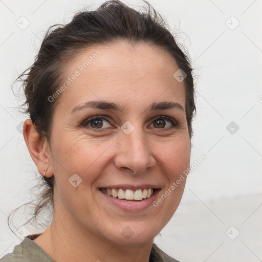 Joyful white adult female with short  brown hair and brown eyes