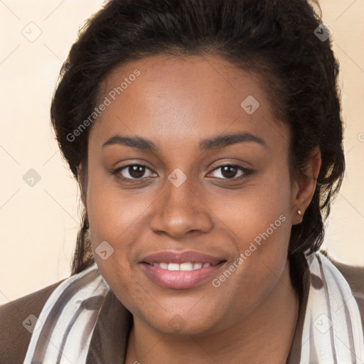 Joyful black young-adult female with long  brown hair and brown eyes