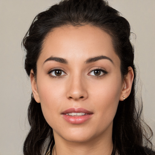 Joyful white young-adult female with long  black hair and brown eyes