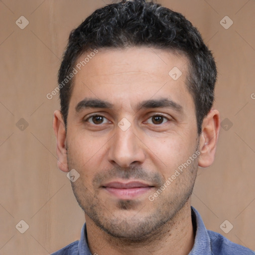 Joyful white young-adult male with short  black hair and brown eyes