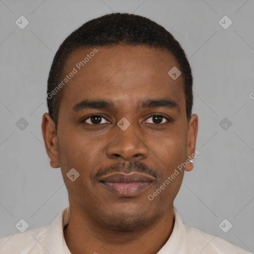 Joyful black young-adult male with short  brown hair and brown eyes