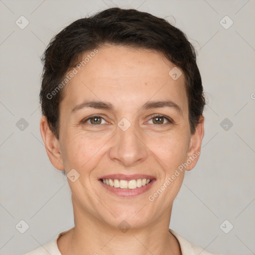 Joyful white adult female with short  brown hair and brown eyes