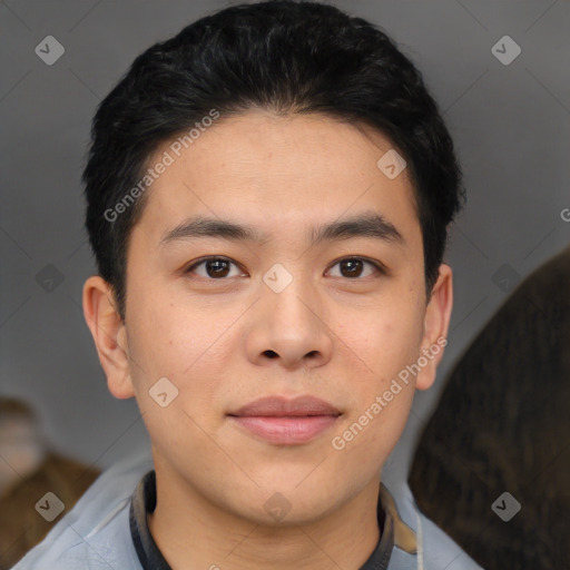 Joyful asian young-adult male with short  brown hair and brown eyes