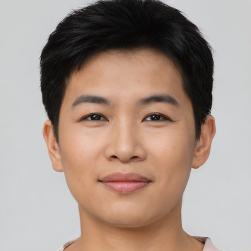 Joyful asian young-adult male with short  black hair and brown eyes