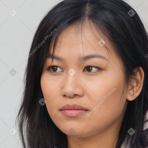 Joyful asian young-adult female with long  brown hair and brown eyes