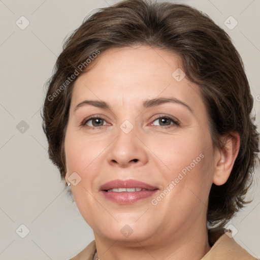 Joyful white adult female with medium  brown hair and grey eyes