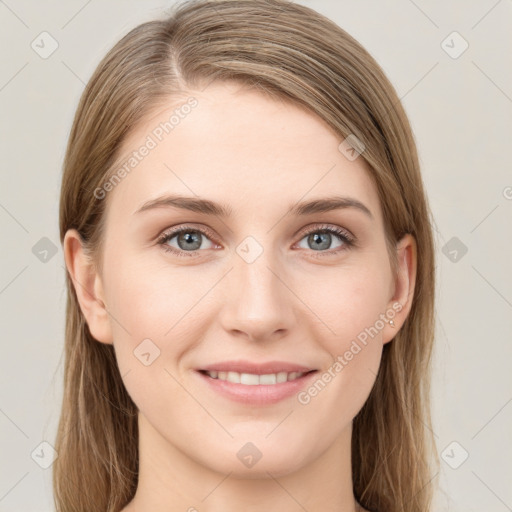 Joyful white young-adult female with long  brown hair and grey eyes