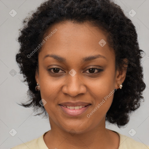 Joyful black young-adult female with medium  brown hair and brown eyes