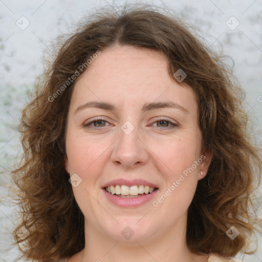 Joyful white adult female with medium  brown hair and green eyes