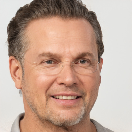 Joyful white middle-aged male with short  brown hair and brown eyes