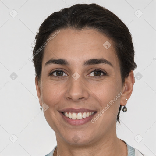 Joyful white young-adult female with short  brown hair and brown eyes