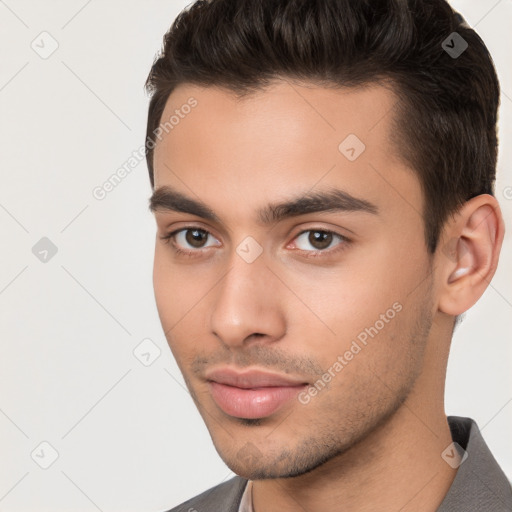 Neutral white young-adult male with short  brown hair and brown eyes