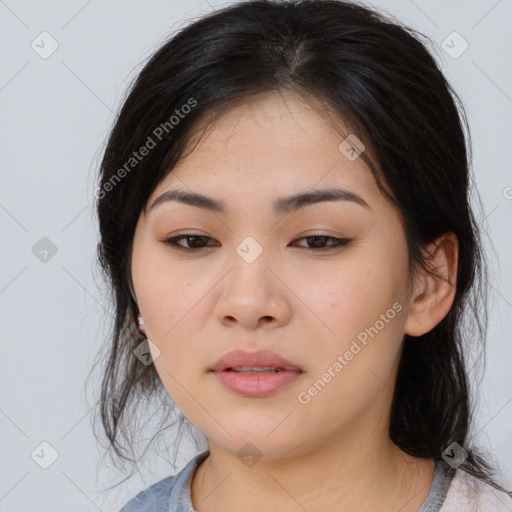 Joyful asian young-adult female with medium  black hair and brown eyes