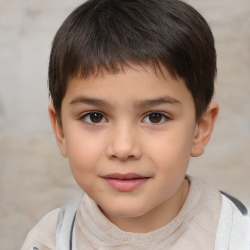 Joyful white child male with short  brown hair and brown eyes